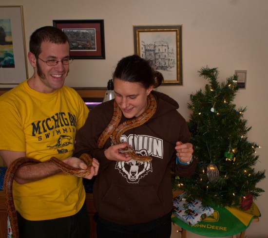 Allison and I pose for Christmas photographs. I'm holding 1.